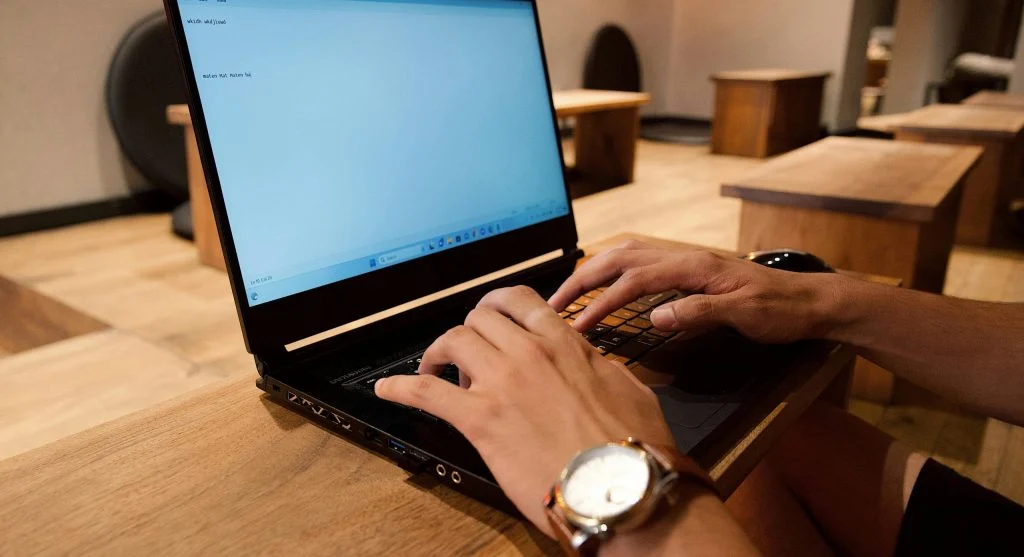 Person turning off a Wi-Fi router to enhance security