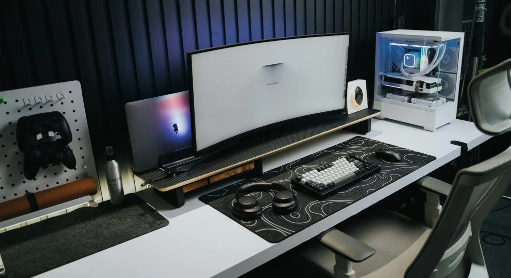 Gaming setup with monitor, keyboard, and chair