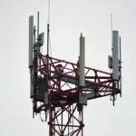 Wi-Fi router with a red X marked through it, surrounded by myth-busting symbols