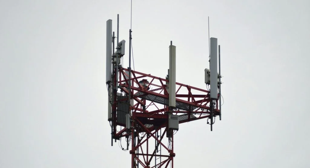 Wi-Fi router with a red X marked through it, surrounded by myth-busting symbols