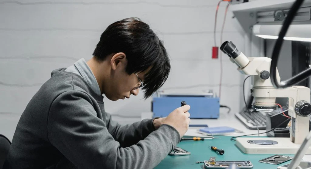 A person restarting their computer to fix technical problems