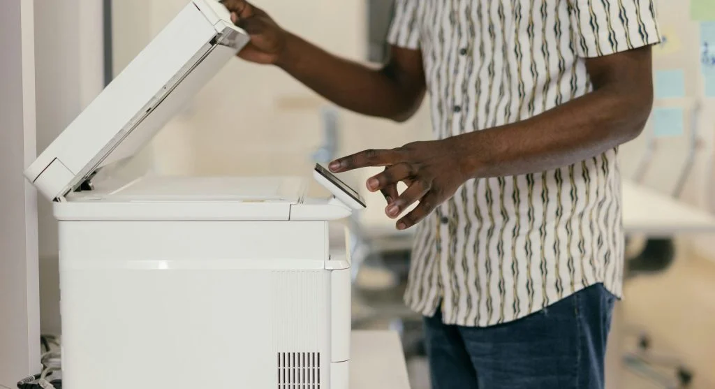 Printer with protective cover to prevent dust and damage